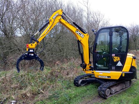 mini excavator log grab attachment|log grapple for mini excavators.